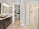 Spa-like bathroom with a walk-in shower and double vanity at 8020 Moonbeam Ave, Sarasota, FL 34241