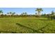 Community dog park with fenced area and playground nearby at 8020 Moonbeam Ave, Sarasota, FL 34241