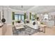 Spacious living room with comfortable seating and large windows at 8020 Moonbeam Ave, Sarasota, FL 34241