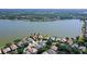 Aerial view of a waterfront home in a luxury community at 8334 Sailing Loop, Lakewood Ranch, FL 34202