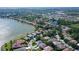 Aerial view showcasing a house near a lake in a community at 8334 Sailing Loop, Lakewood Ranch, FL 34202