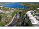 Gated community entrance with lake and houses visible at 8334 Sailing Loop, Lakewood Ranch, FL 34202