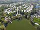 Aerial view of community lake and houses at 8334 Sailing Loop, Lakewood Ranch, FL 34202