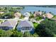Aerial view of houses with lake views and lush landscaping at 8334 Sailing Loop, Lakewood Ranch, FL 34202