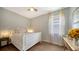 Bedroom with a king-size bed, light wood floors, and window at 8334 Sailing Loop, Lakewood Ranch, FL 34202