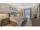 Main bedroom with a king-size bed, wood furniture, and private access to the pool at 8334 Sailing Loop, Lakewood Ranch, FL 34202