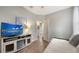 Bedroom with daybed, TV, and access to pool view at 8334 Sailing Loop, Lakewood Ranch, FL 34202