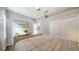 Bedroom with king-size bed, wood floors, and double doors at 8334 Sailing Loop, Lakewood Ranch, FL 34202