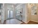 Elegant entryway with light blue door and a console table at 8334 Sailing Loop, Lakewood Ranch, FL 34202