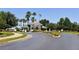 Gated entrance to a community with palm trees at 8334 Sailing Loop, Lakewood Ranch, FL 34202