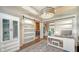 Spacious home office with a barn door and hardwood floors at 8334 Sailing Loop, Lakewood Ranch, FL 34202