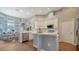 Modern kitchen with white cabinets, island and stainless steel appliances at 8334 Sailing Loop, Lakewood Ranch, FL 34202