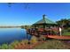 Wooden gazebo on a dock overlooking the lake at 8334 Sailing Loop, Lakewood Ranch, FL 34202