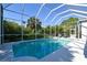 Inviting screened pool with a view of the backyard at 8334 Sailing Loop, Lakewood Ranch, FL 34202