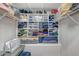 Well-organized walk-in closet with shelving and drawers at 8334 Sailing Loop, Lakewood Ranch, FL 34202