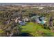 Aerial view of community with clubhouse, pool, and tennis courts at 8544 54Th Avenue E Cir, Bradenton, FL 34211