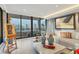 Bright living room with contemporary decor, city views, and access to a private balcony at 1255 N Gulfstream Ave # Ph1501, Sarasota, FL 34236
