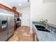Kitchen boasts stainless steel appliances and granite countertops at 1296 Skagway Ter, North Port, FL 34291