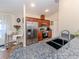 Modern kitchen with stainless steel appliances and granite countertops at 1296 Skagway Ter, North Port, FL 34291