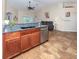 Kitchen features granite countertops and stainless steel dishwasher at 1296 Skagway Ter, North Port, FL 34291