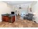 Spacious living room with gray sectional sofa and tile floors at 1296 Skagway Ter, North Port, FL 34291