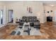 Living room features high ceilings, gray sectional and tile floors at 1296 Skagway Ter, North Port, FL 34291
