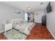 Main bedroom with hardwood floors, and en-suite bathroom access at 1296 Skagway Ter, North Port, FL 34291
