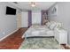 Bright main bedroom featuring a king-size bed and en-suite access at 1296 Skagway Ter, North Port, FL 34291
