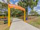 Playground entrance with a yellow arch at 1296 Skagway Ter, North Port, FL 34291