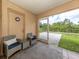 Relaxing screened porch with outdoor seating and backyard view at 1296 Skagway Ter, North Port, FL 34291