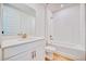 Clean and modern bathroom with white fixtures and tiled walls at 14010 Ginnie Springs Way, Parrish, FL 34219