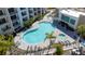 Bird's-eye view of the community pool, spa, and surrounding landscaping at 1709 N Tamiami Trl # 214, Sarasota, FL 34234