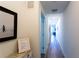 Bright hallway with wood-style flooring leading to the living area at 1709 N Tamiami Trl # 214, Sarasota, FL 34234