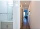 Bright hallway leading to a living area with a glimpse of a balcony at 1709 N Tamiami Trl # 214, Sarasota, FL 34234