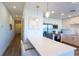 Modern kitchen with stainless steel appliances, white countertops, and bar seating at 1709 N Tamiami Trl # 214, Sarasota, FL 34234