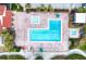 Large community pool with multiple lounging areas and hot tub at 1935 Gulf Of Mexico Dr # G7-302, Longboat Key, FL 34228