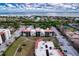 Aerial view of building, parking, and oceanfront location at 1935 Gulf Of Mexico Dr # G7-302, Longboat Key, FL 34228