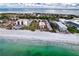Aerial view of beach, ocean and condo complex at 1935 Gulf Of Mexico Dr # G7-302, Longboat Key, FL 34228