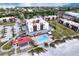 Aerial view of building, pool, and beach access at 1935 Gulf Of Mexico Dr # G7-302, Longboat Key, FL 34228