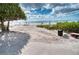 Beach access with loungers and umbrellas at 1935 Gulf Of Mexico Dr # G7-302, Longboat Key, FL 34228