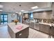 Modern community kitchen with an island and stainless steel appliances at 1935 Gulf Of Mexico Dr # G7-302, Longboat Key, FL 34228