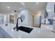 Kitchen features a black farmhouse sink and quartz countertop at 1935 Gulf Of Mexico Dr # G7-302, Longboat Key, FL 34228