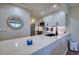 White kitchen with quartz countertops and black accents at 1935 Gulf Of Mexico Dr # G7-302, Longboat Key, FL 34228