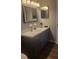 Bathroom vanity with dark wood cabinets and white countertop at 214 Genet Ct, Sun City Center, FL 33573