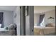 View from the hallway showing two bedrooms with beds, dressers, and curtains at 214 Genet Ct, Sun City Center, FL 33573
