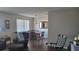Dining area with wood table, leather chairs, and view into living room at 214 Genet Ct, Sun City Center, FL 33573