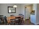 Dining area with wood table and chairs, adjacent to the kitchen at 214 Genet Ct, Sun City Center, FL 33573