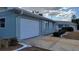 Concrete driveway and attached garage of a single-story house at 214 Genet Ct, Sun City Center, FL 33573