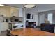 Kitchen with light cabinets, granite counters, and stainless steel appliances at 214 Genet Ct, Sun City Center, FL 33573