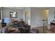 Living room and dining area with wood-look floors and leather furniture at 214 Genet Ct, Sun City Center, FL 33573